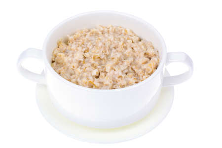 Oatmeal porridge in a white bowl, isolateの写真素材