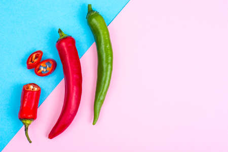 Chili peppers on pastel bright backgroundの写真素材