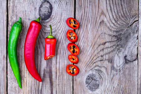 Hot pepper on wooden tableの写真素材