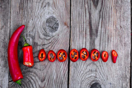 Hot pepper on wooden tableの写真素材