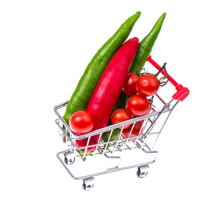 Ripe red cherry tomatoes in small cartの写真素材