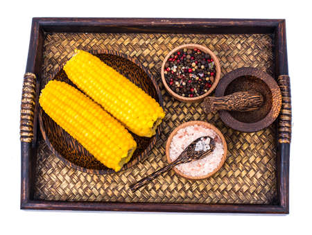 Delicious hot cobs of boiled sweet corn on wooden background. Studio Photoの写真素材