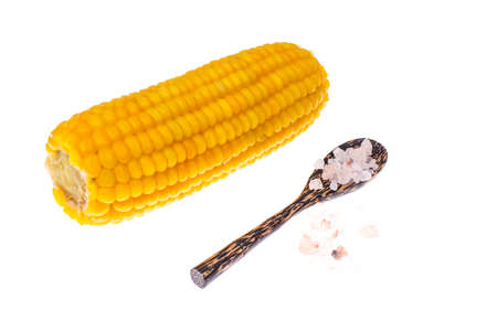 Boiled corn with salt, isolated on white backgroundの写真素材