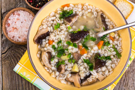 Soup with pearl barley and forest mushroomsの写真素材