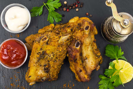 Pork ribs grilled with herbs on black backgroundの写真素材