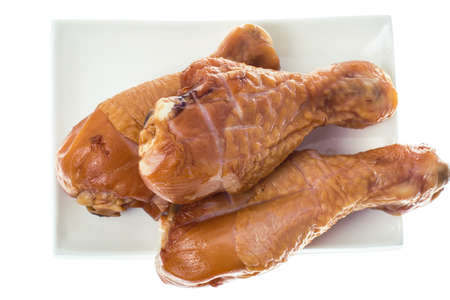 Smoked chicken pieces on white backgroundの写真素材