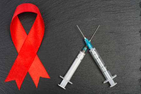 Medical concept, red ribbon-symbol of AIDS Day, December 1stの写真素材