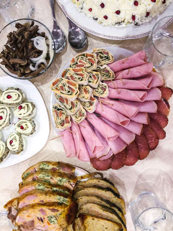 Marinated mushrooms, stuffed eggs, rolls of ham, stuffed chicken- holiday family dinner