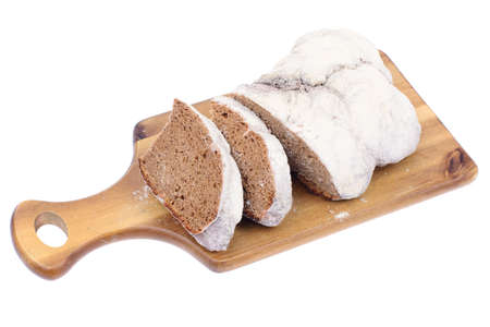fresh baked bread with white crust, sprinkled with flour
