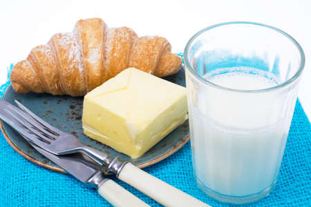 Fresh croissant with butter for breakfastの写真素材
