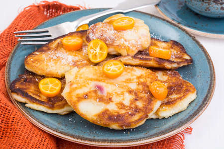 Sweet pancakes with fruit on white tree