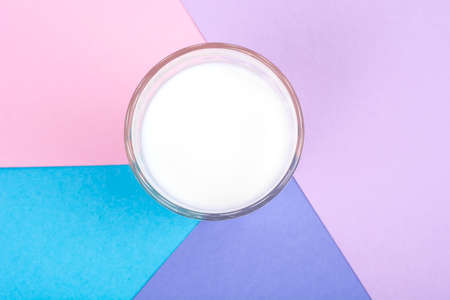 Glass with milk on bright backgroundの写真素材