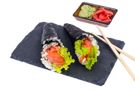 Tasty fresh sushi cone on black stoneの写真素材