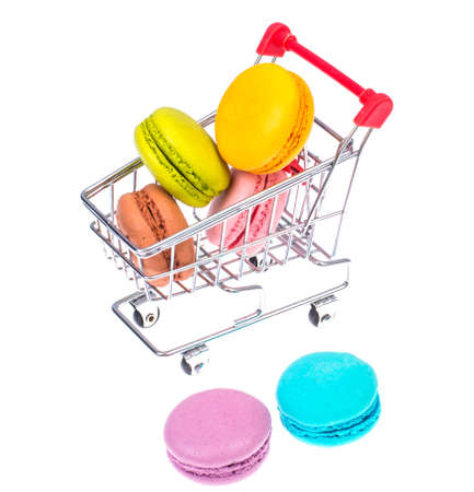 Macaroons in metal shopping basketの写真素材