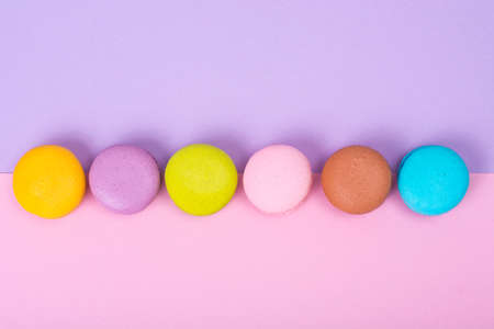 Small French macaroons on pastel backgroundの写真素材