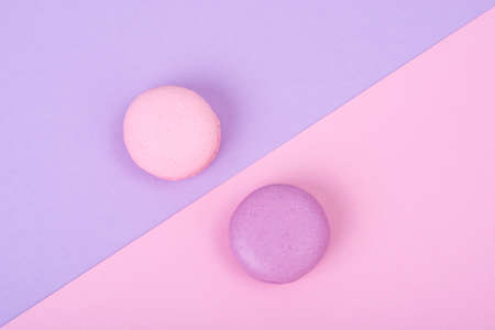 Small French macaroons on pastel background