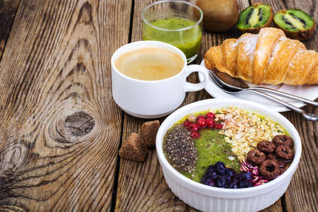 Espresso, croissant and fruit dessert for breakfastの写真素材