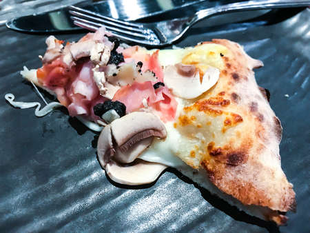 Delicious pizza with parma, champignons and pieces of black truffle. Studio photoの写真素材