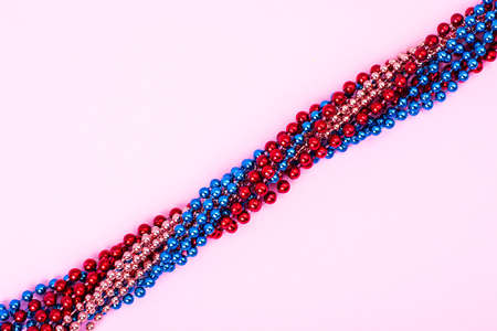 Multi color Mardi Gras beads on bright backgroundの写真素材