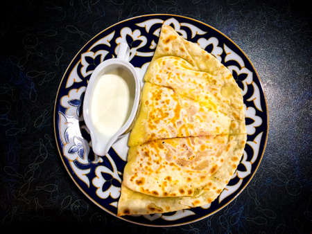 Thin delicious pancakes, sour cream sauceの写真素材