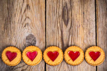 Heart shaped cookies on wooden tableの写真素材