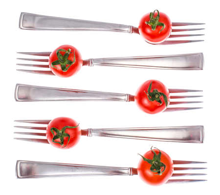 Concept of dietary healthy nutrition. Cherry tomatoes on forksの写真素材