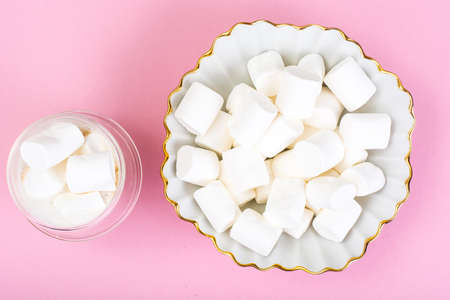 White marshmallow on pink backgroundの写真素材
