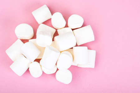 White marshmallow on pink backgroundの写真素材