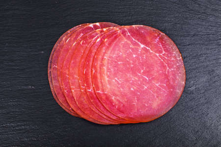 Ham cut on black plateの写真素材