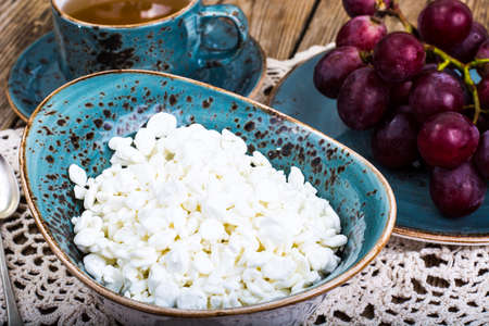 Useful breakfast with cottage cheese and grapes. Studio Photoの写真素材