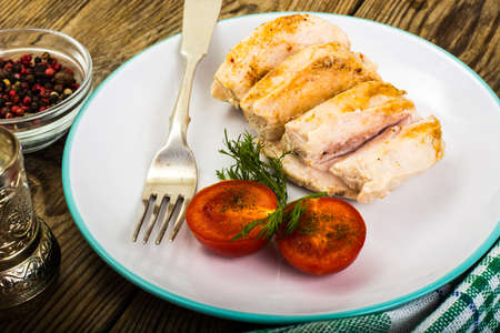 Boiled chicken fillet and tomatoes cherry-healthy diet food, protein lunch and dinner. Studio Photoの写真素材