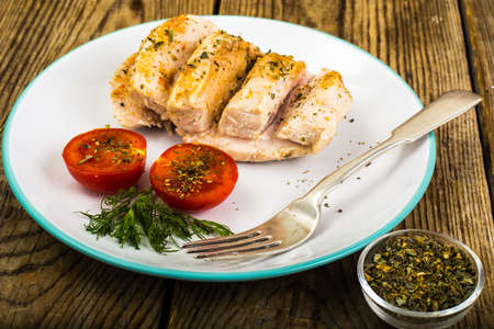 Boiled chicken fillet and tomatoes cherry-healthy diet food, protein lunch and dinner. Studio Photoの写真素材