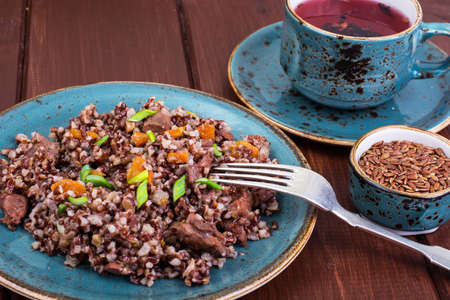 Garnish of red rice, garlic, vegetables, chicken meat. Studio Photoの写真素材