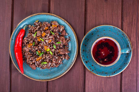 Garnish of red rice, garlic, vegetables, chicken meat. Studio Photoの写真素材