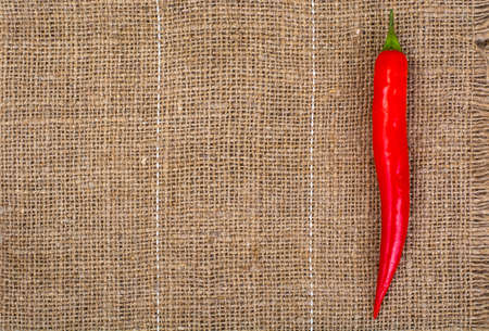 Pod of red chili peppers on fabric background. Studio Photoの写真素材