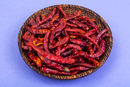 Many pods of dried chili red pepper on pastel background. Studio Photoの写真素材