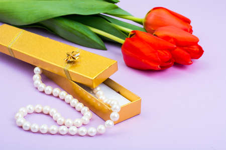 Bouquet of tulips and jewelry as gift. Studio Photoの写真素材