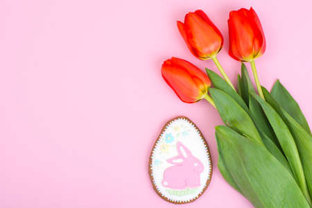 Easter gifts, sweet gingerbreads, flowers on pastel background. Studio Photoの写真素材