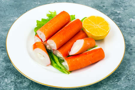 Surimi crab sticks on plateの写真素材