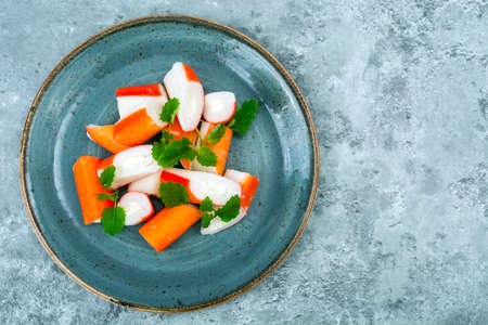 Surimi crab sticks on plateの写真素材