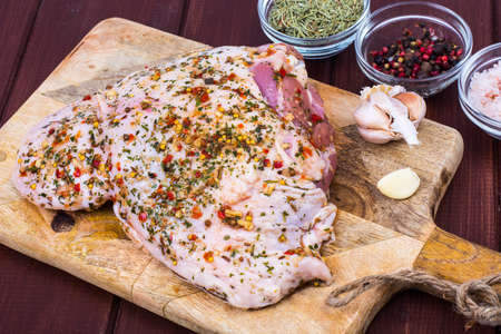Turkey meat with spices and herbs on cutting board. Studio Photoの写真素材
