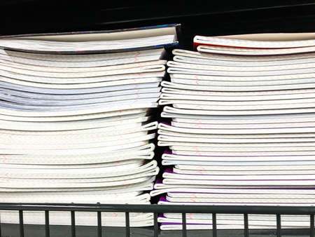 Pile of school notebooks on  shelf. Studio Photo
の写真素材