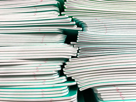 Pile of school notebooks on  shelf. Studio Photo
の写真素材