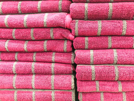 Stacks of colored terry towel on shelves. Studio Photoの写真素材
