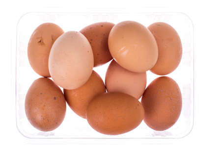 Fresh colored chicken eggs in plastic box