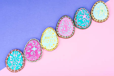 Easter eggs formed as tasty homemade cookies on bright backgroundの写真素材
