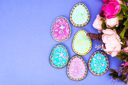 Easter eggs formed as tasty homemade cookies on bright backgroundの写真素材