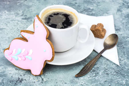 Cup of delicious espresso and traditional Easter cookieの写真素材