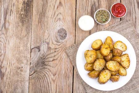 Slices of potato-grilled with rosemaryの写真素材