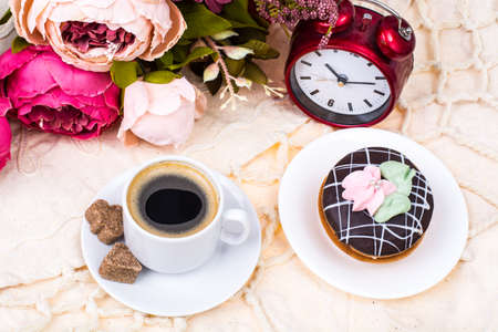 Romantic breakfast. Cup of strong hot espresso and cakeの写真素材